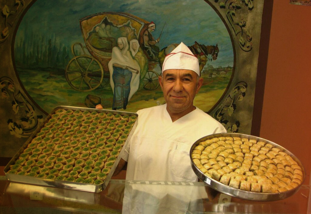 the baklava king shows his product