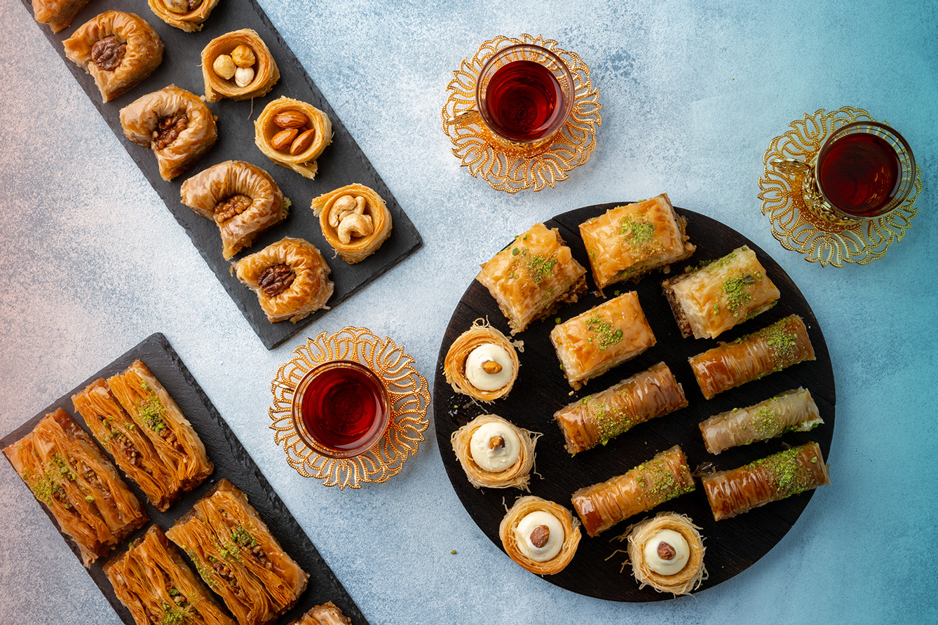 Top view of baklava desserts served on light blue background