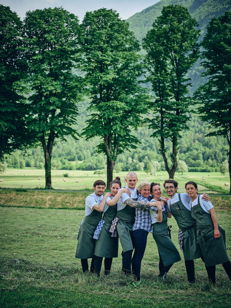 michelin star restaurants in slovenia	- the owner with the staff stands on meadow