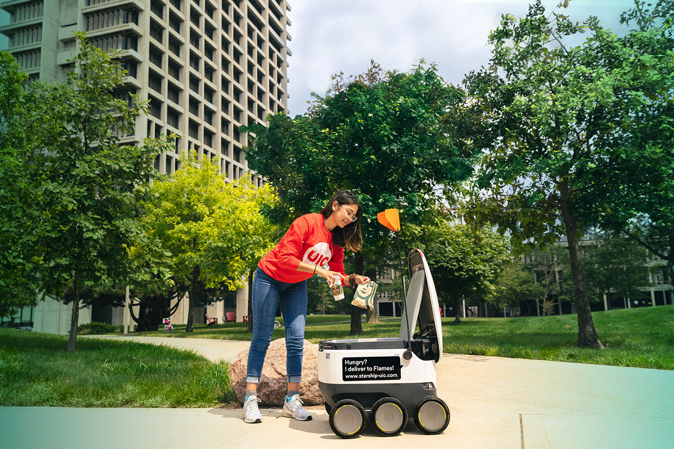 woman and delivery robot
