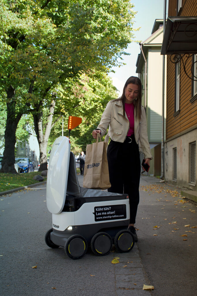 delivery robot with woman