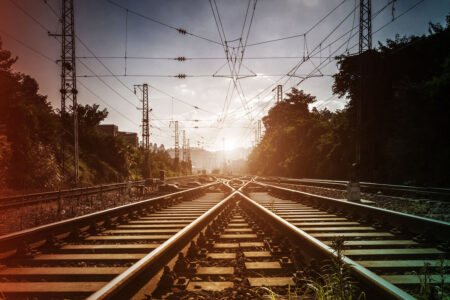 railway lines leading into the distance and sunlight