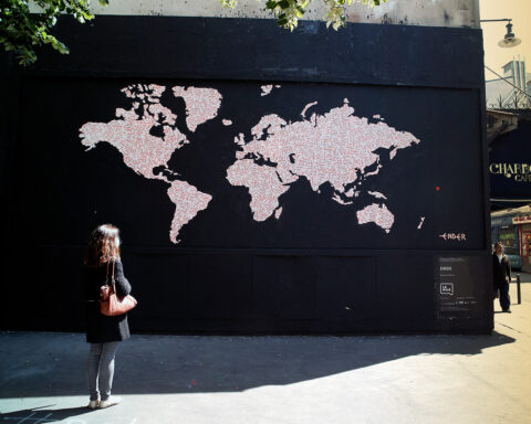 woman watch map painted on a wall