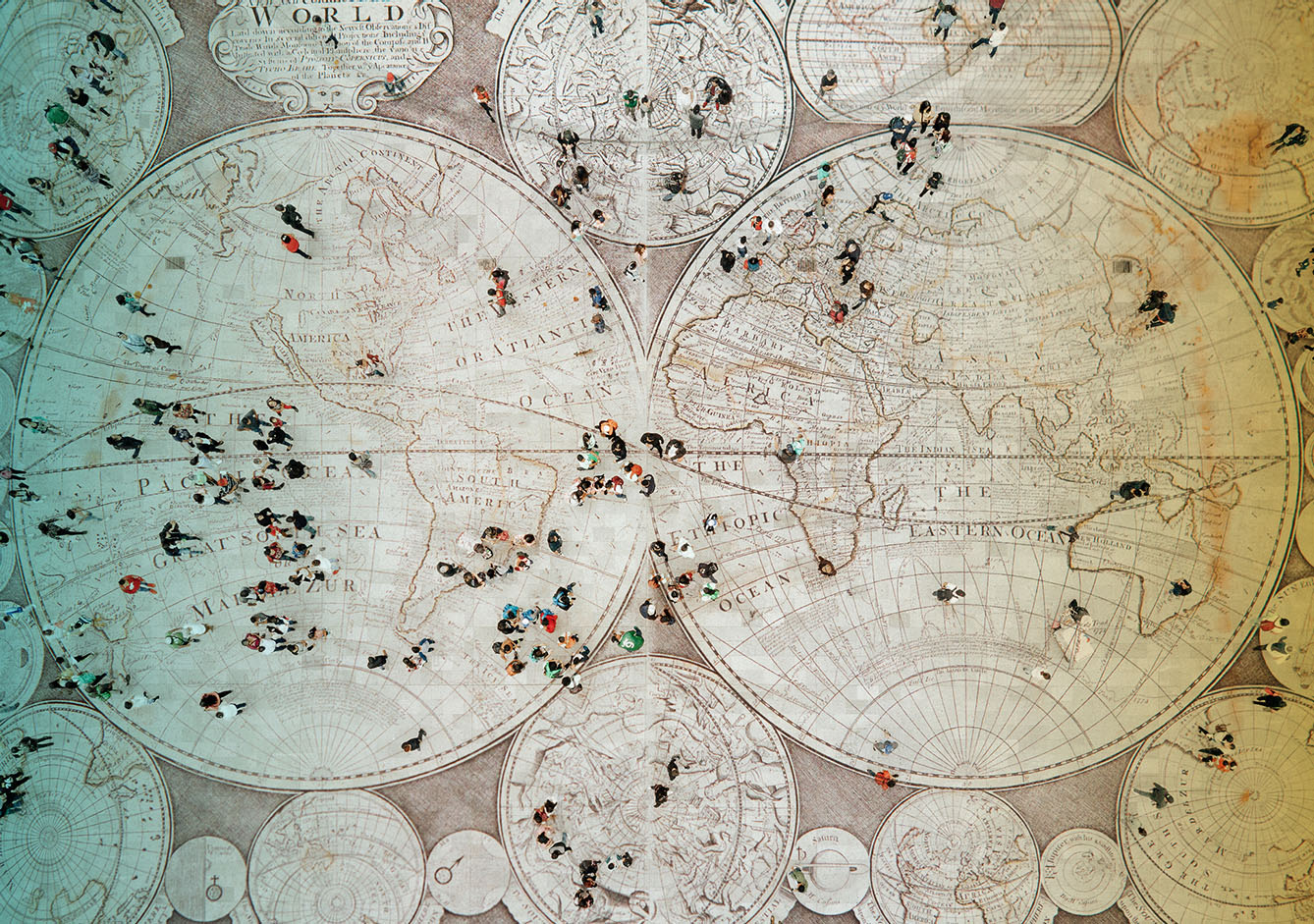 Crowd walking on global map. Composition made with antique map from 1779