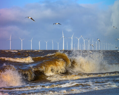 Wind turbines in an offshore wind park during a storm