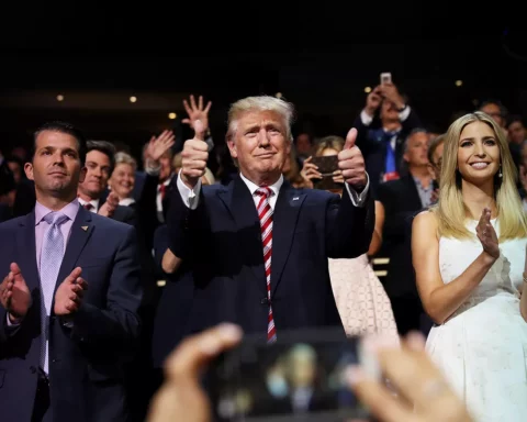 Donald Trump (C) gives two thumbs up as Donald Trump Jr. (L) and Ivanka Trump (R) stand and cheer for Eric Trump