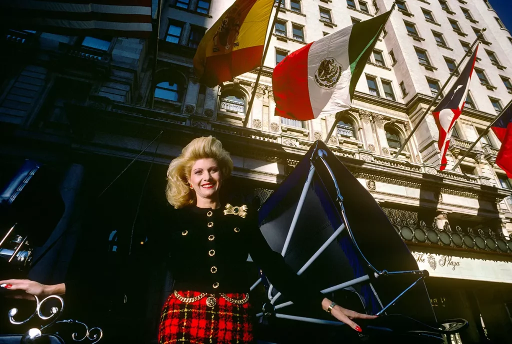 Ivana Trump poses in horse carriage outside the Plaza Hotel, which was bought by her then husband, Donald Trump