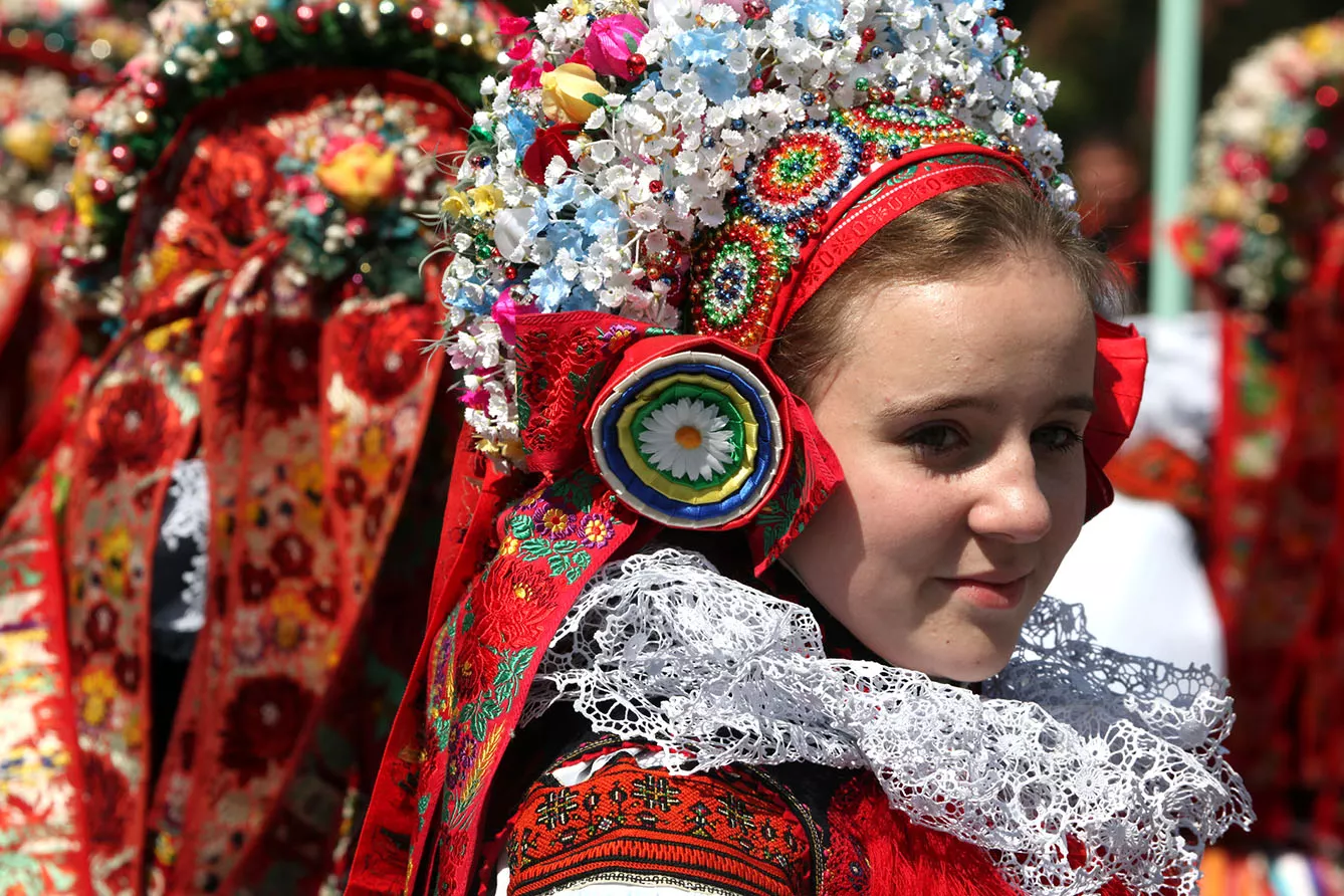 oung women dressed in traditional Moravian folk costumes attend the Ride of the Kings folklore festival