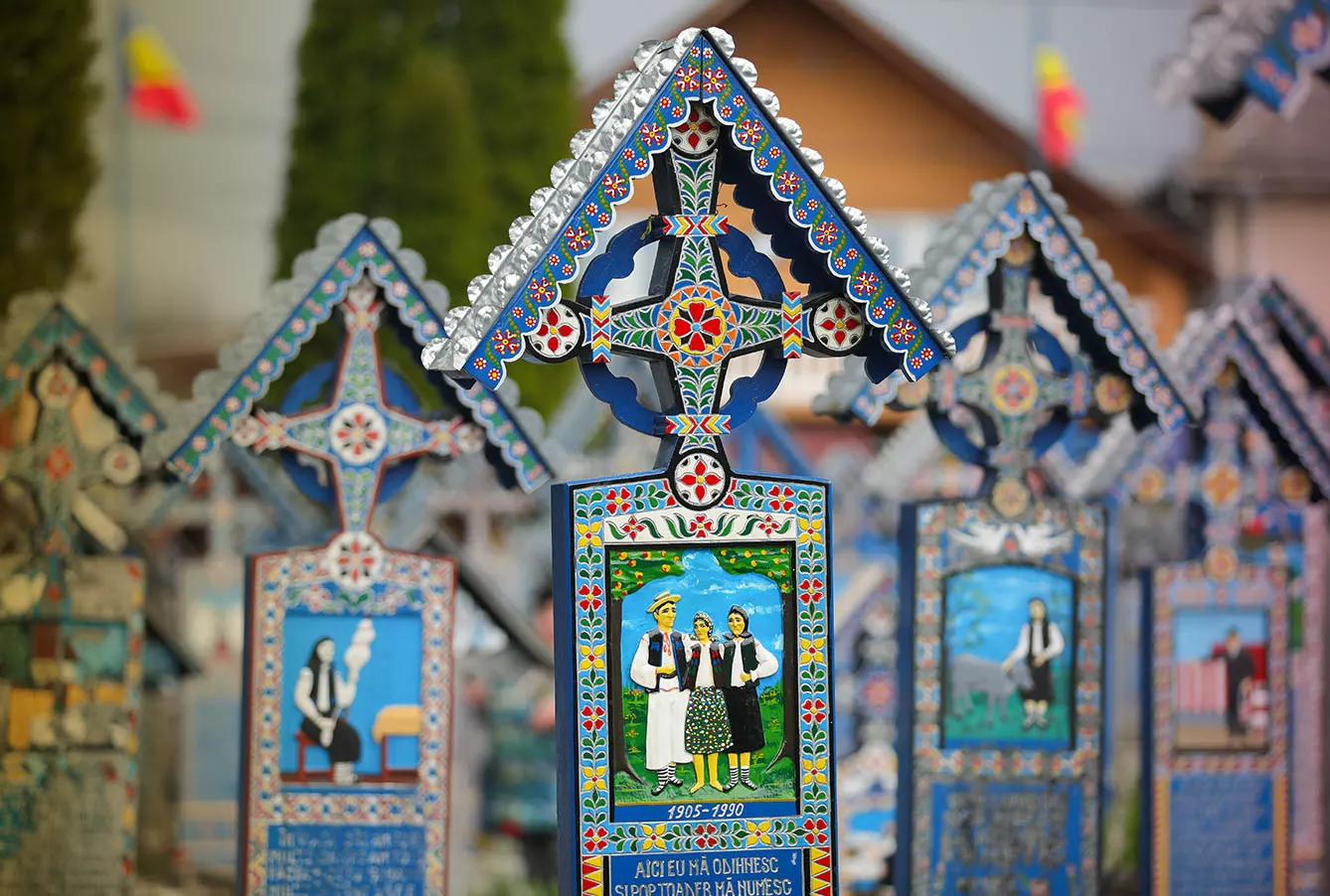 Vivid painted wooden tombstones at Merry Cemetery, Famous graveyard in Sapanta, county of Maramures, Romania