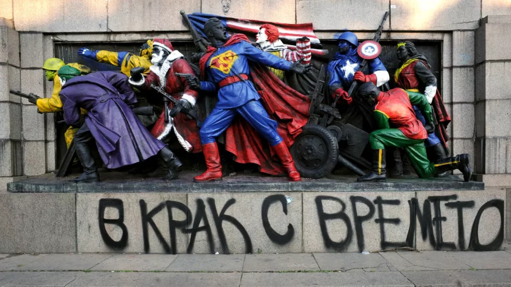 picture taken in Sofia shows the figures of Soviet soldiers at the base of the Soviet Army monument painted to resemble U.S. comic book heroes and characters from popular culture
