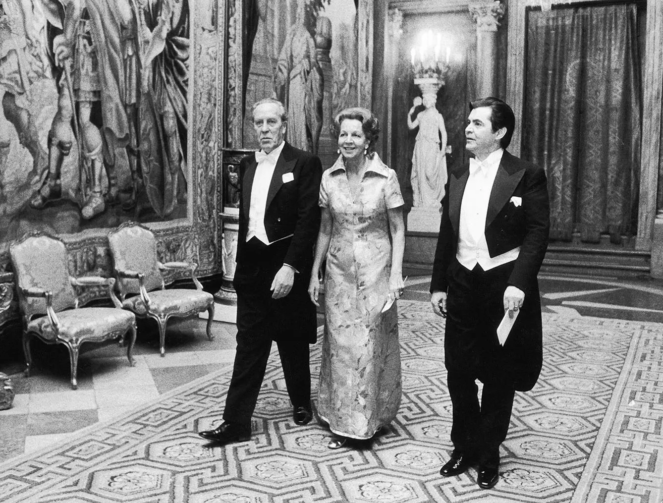 George Emil Palade (right) arrives at Stockholm Castle in the company of Swedish foreign minister Sven Andersson and his wife December 1974