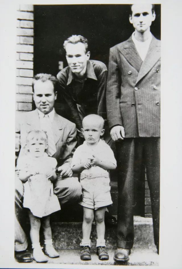 archive photo of Warhol brother, Paul with children, Andy and John