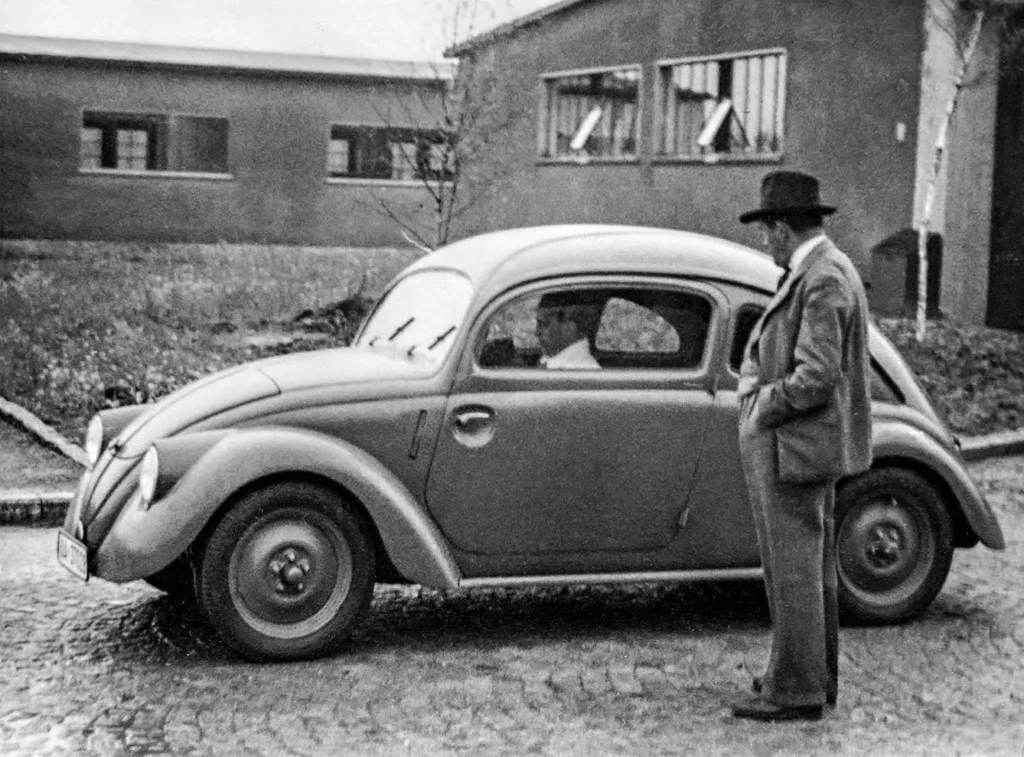 Ferdinand Porsche designer with a KDF Wagen VW Volkswagen peoples car prototype model