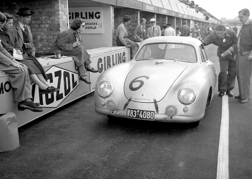 A porsche 356 coupe in the pits