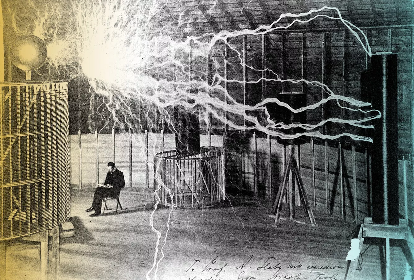 Tesla studying electricity in the laboratory