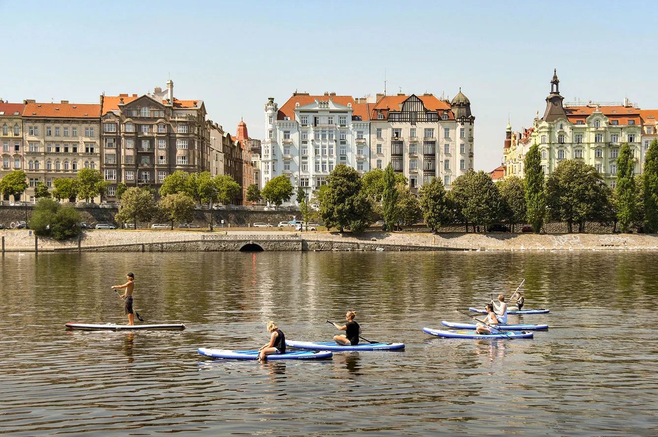 Group of people paddleboarding on the River Vltava in Prague