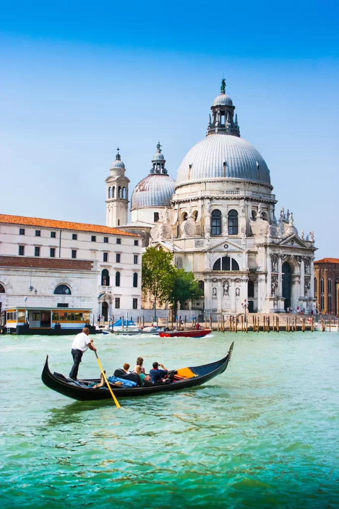 Traditional Gondola on Canal Grande with Basilica di Santa Maria della Salute