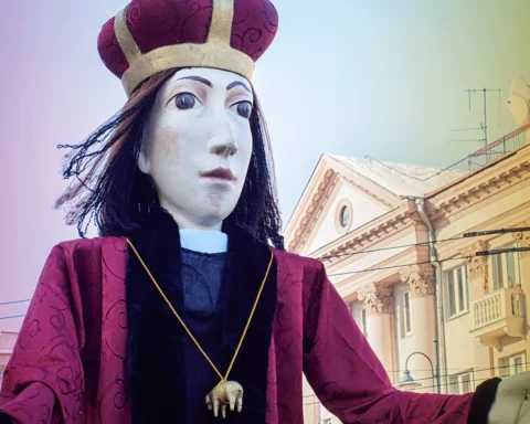 Giant figure of Saint Casimir carrying by people at traditional theatrical Kaziukas
