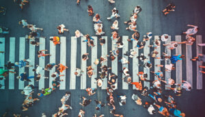 Aerial view of people crowd on pedestrian crosswalk