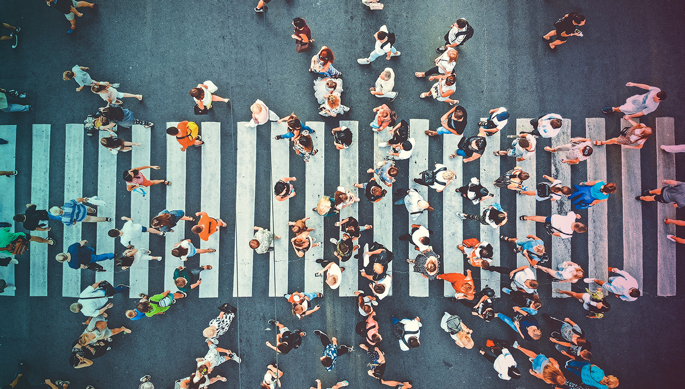 Aerial view of people crowd on pedestrian crosswalk