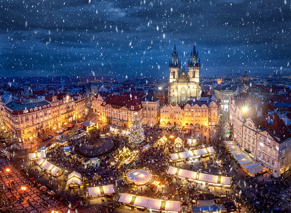 View of the old town square of Prague, Czech Republic, during winter time with the traditional Christmas Market under snow