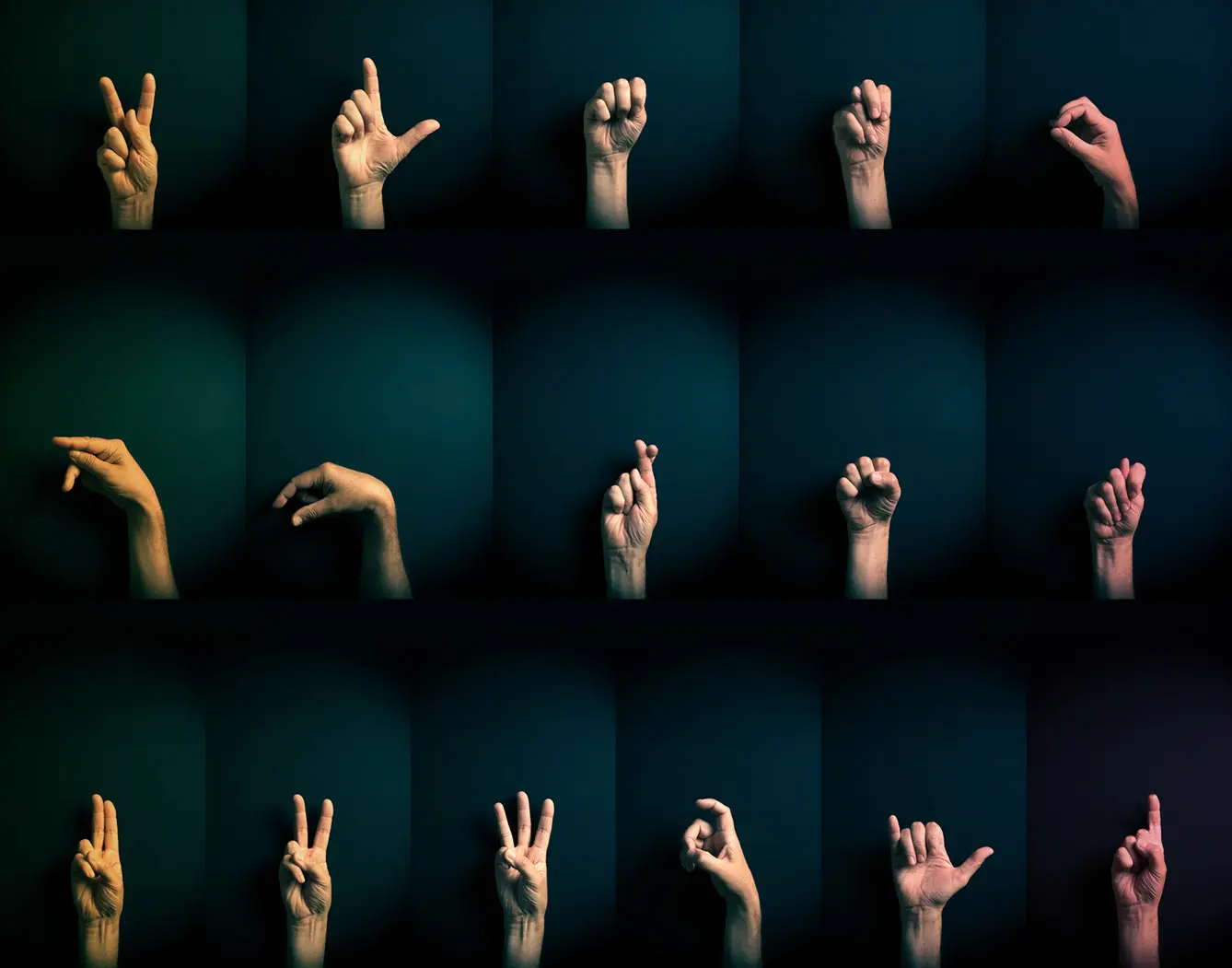 Colour image of hands demonstrating ASL sign language letters