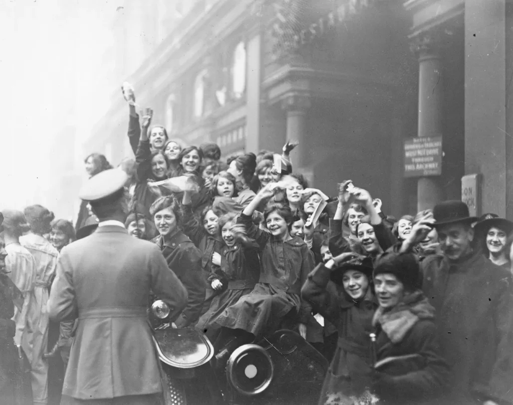 Crowds celebrating the armistice in London