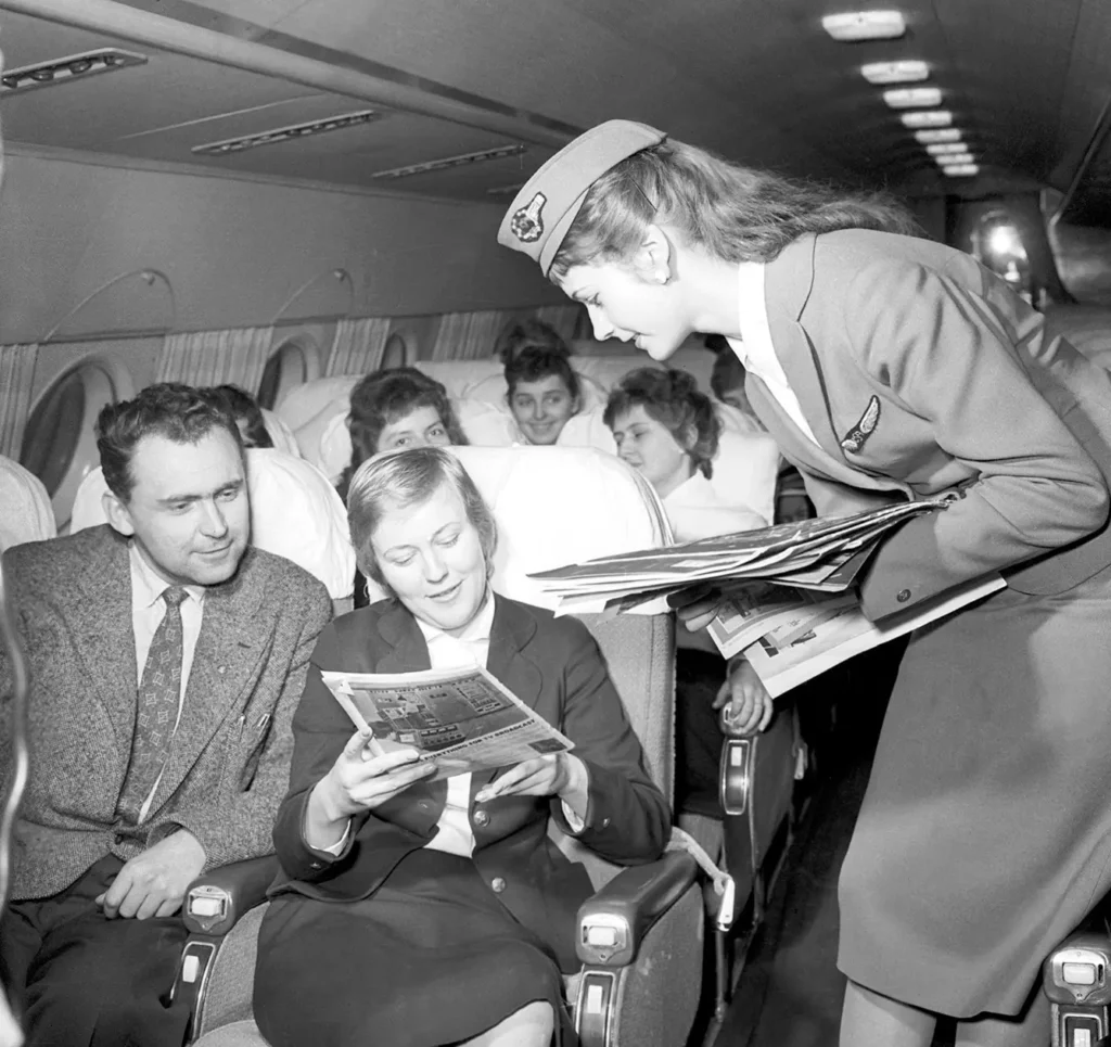 flight attendant in Il-18 aircraft. A view of the plane with passengers