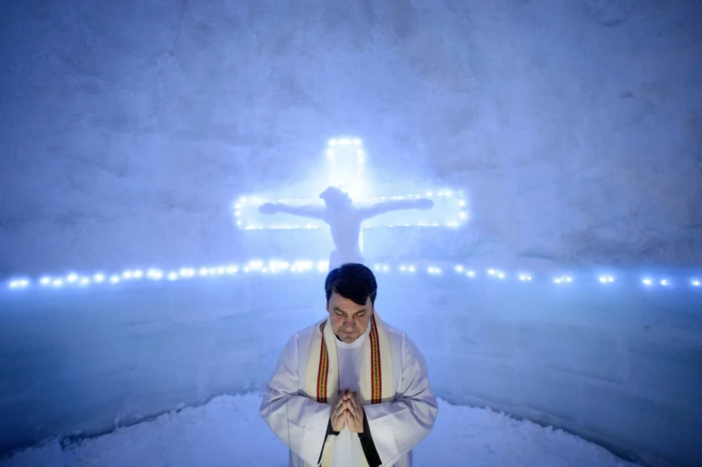 Priest in church built from blocks of ice, near Balea Lake