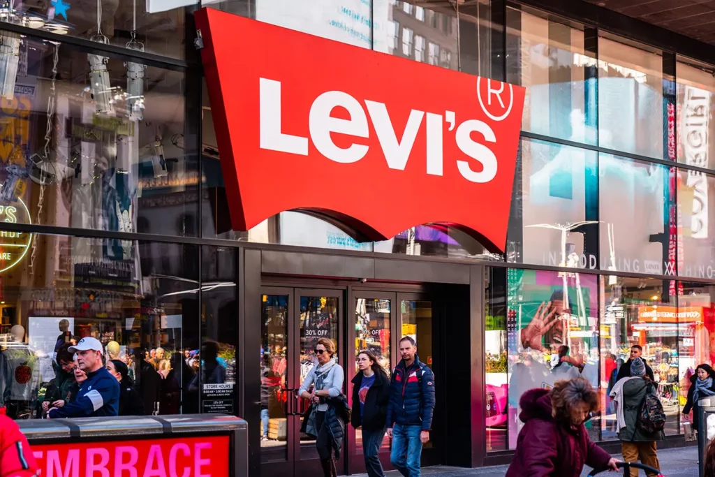 Pedestrians walk past an American clothing company, Levi's store in Midtown Manhattan
