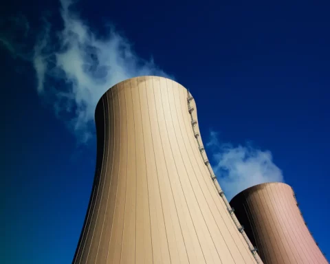 Cooling towers of nuclear power plant against the blue sky