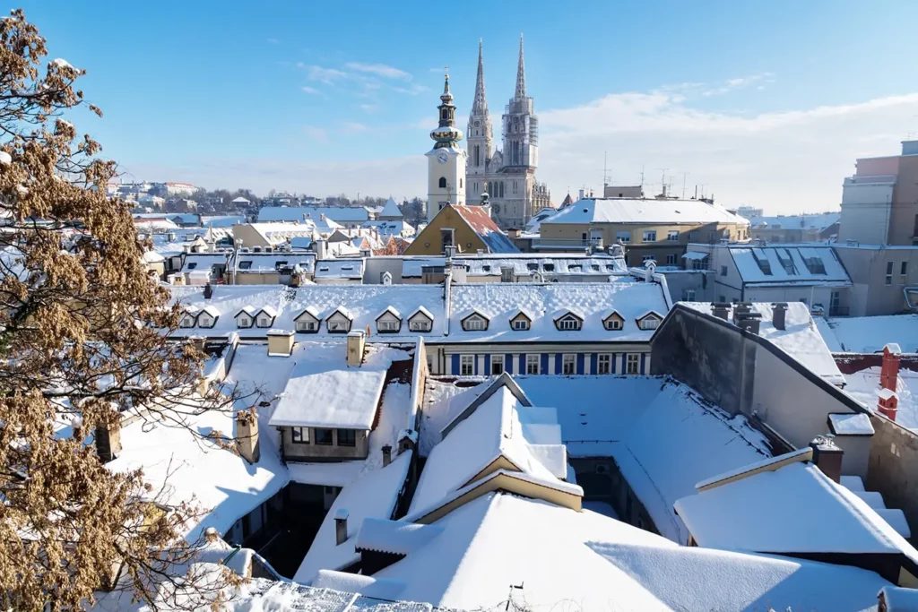 View over Zagreb during winter with snow with view to towers of church and cathedral at a sunny day