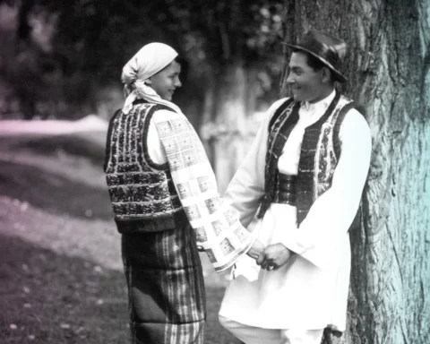 Couple in traditional costume in Bistrita Valley on archive black and white photo