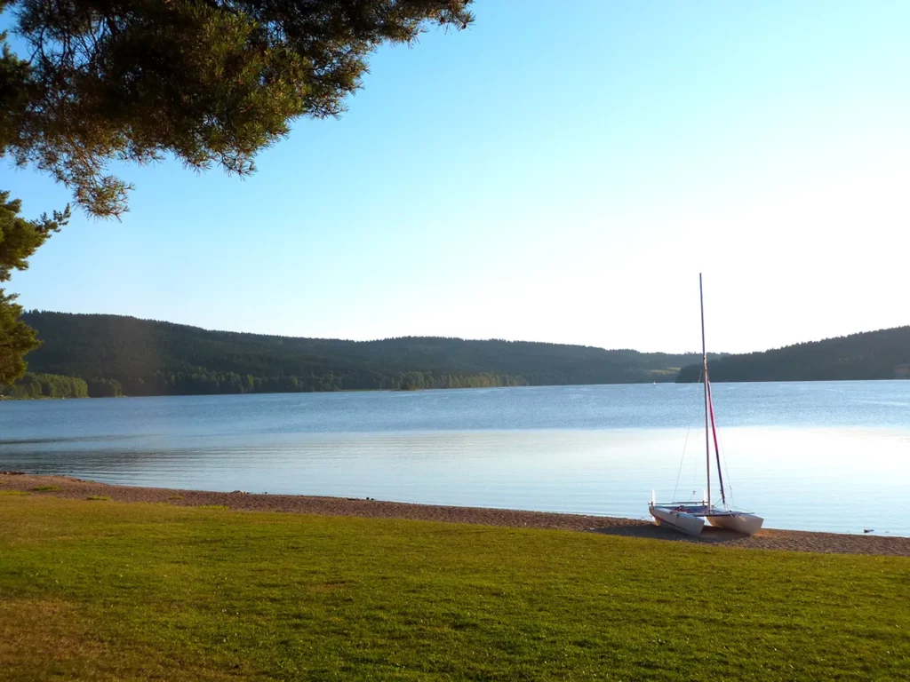 A sailing boat on shore of Lipno Lake in Czech Republic on sunny day