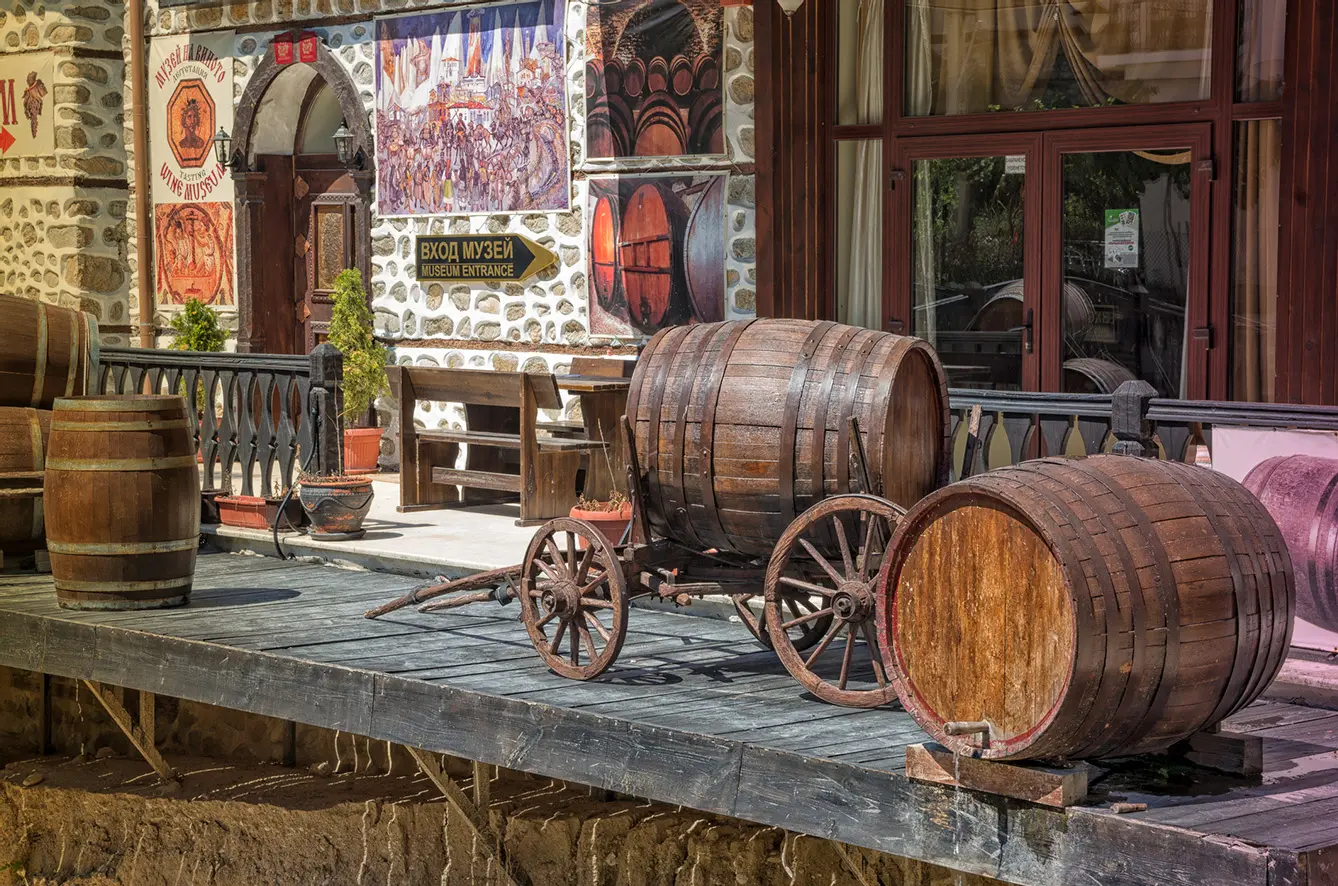 Wooden barrels in front of wine museum in a of city of Melnik a small town in southwest Bulgaria in Pirin Mountains famous with its traditional architecture and local wine