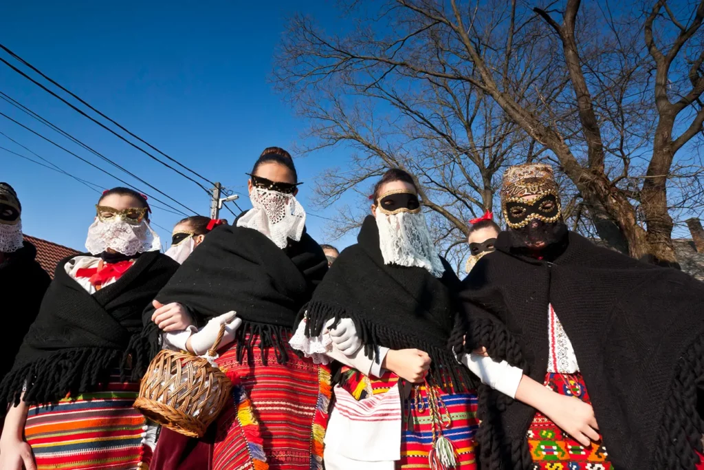 Sokac women in mask and traditional costume at the Busojaras, the carnival of winter's funeral in Mohacs, Hungary