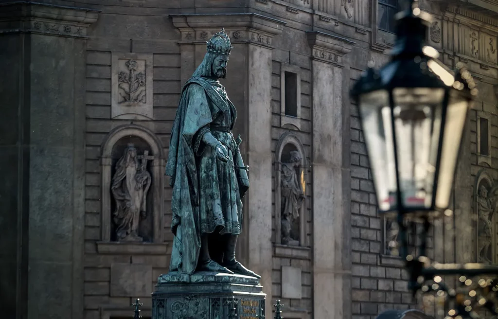 A statue of ruler Charles IV stands next to the Charles Bridge