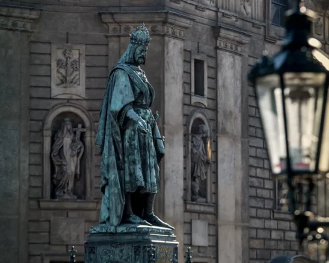 A statue of ruler Charles IV stands next to the Charles Bridge