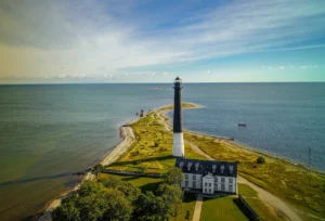 The image shows the lighthouse located on the southern tip of the peninsula on the island of Saaremaa, aerial view