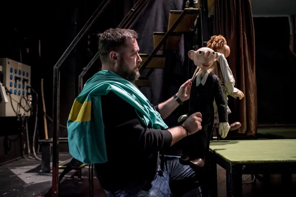 Matej Kopecky jr, puppeteer of the Theatre of Spejbl and Hurvinek prepares a puppet before a performance in Prague