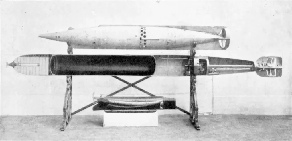 This photo, probably taken at Fiume around 1895, shows three stages of the Whitehead torpedo. At the bottom, Giovanni Luppi's Küstenbrander, which was the inspiration for Robert Whitehead's work. At the top, the 1868-1870 model with its characteristic fins. In the middle an 1890's model, cut out to show the interior, but not the secret parts with the hydrostat.