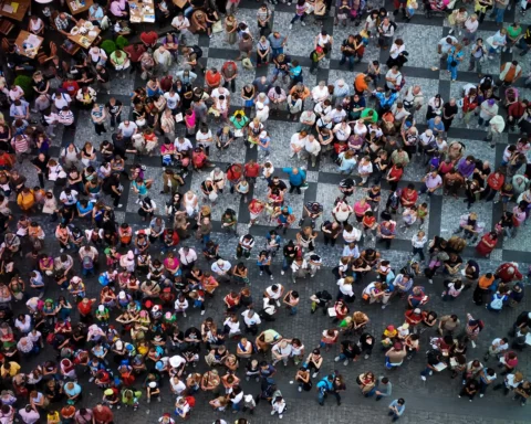 Aerial photograph of people at the Old Town Square in Prague