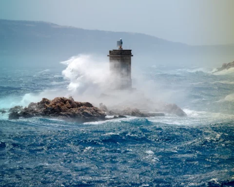 Waves break over the lighthouse, Rab, Croatia