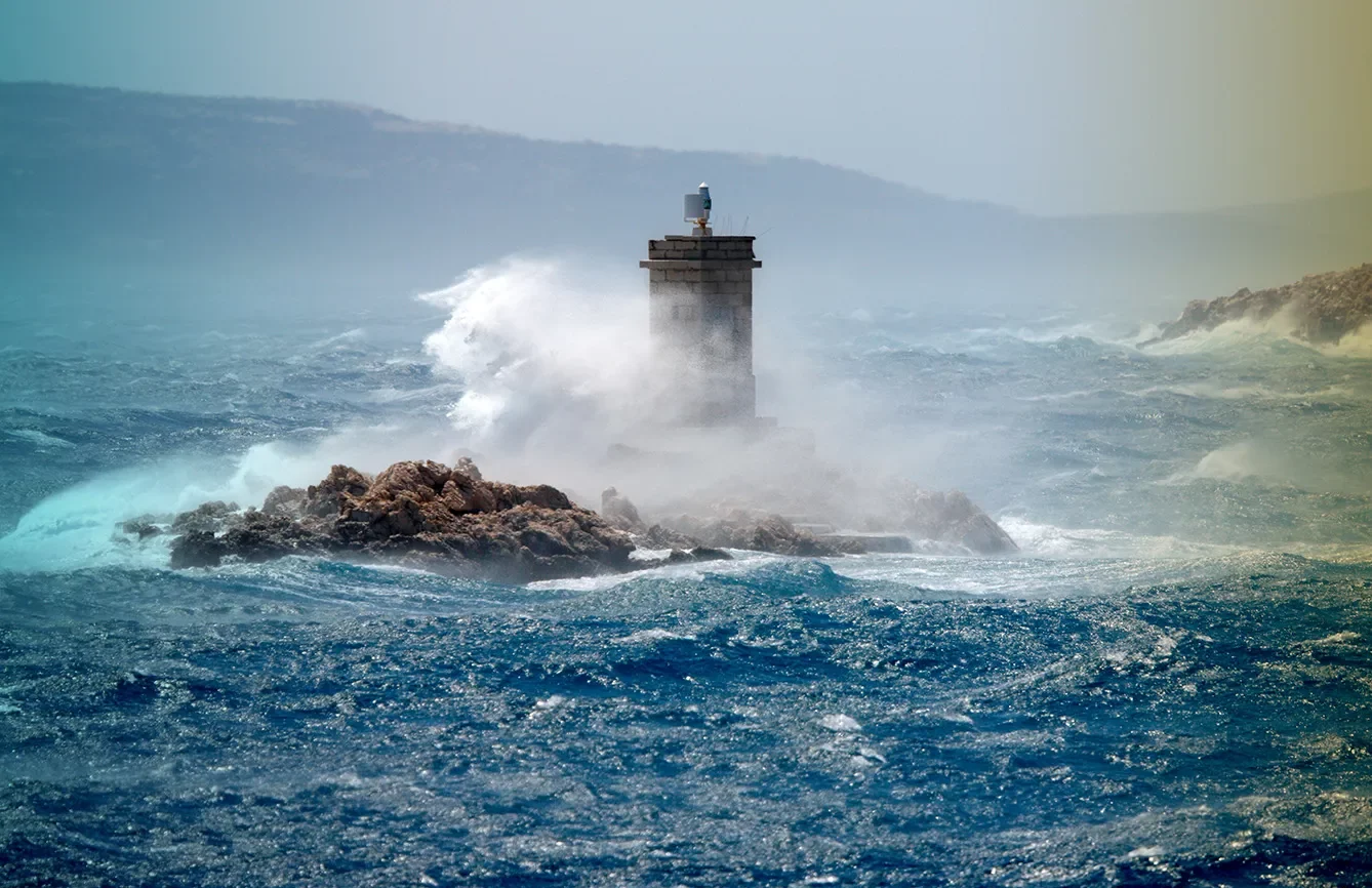 Waves break over the lighthouse, Rab, Croatia