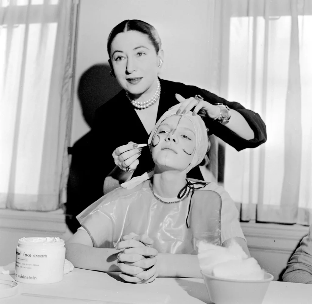 Beauty Tips, circa 1935: Beauty expert Helena Rubinstein illustrating the shape of the basic lines on the face so that make-up can be applied to flatter individual contours.