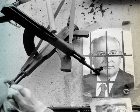 U.S.S.R. Lithuania. Vilnius. Soviet Intervention. 1991. Toy guns over a photo of Mikhael GORBATCHEV behind bars in the building of the Supreme Council. 1991.
