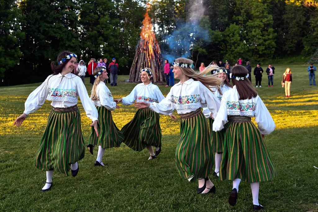 SINIMAE, June 24, 2017 - People in traditional Estonian costumes dance to welcome the Midsummer Day in Sinimae, northeast Estonia, on the night of June 23, 2017. Midsummer Day, an old traditional public holiday in Estonia, falls on June 24.