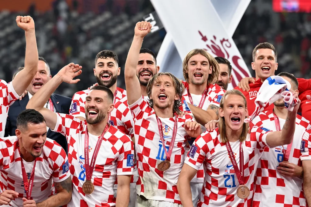 Players of Croatia including Modrić celebrate, whilst wearing their Third Placed Medals, after the final whistle of the FIFA World Cup Qatar 2022 3rd Place match between Croatia and Morocco at Khalifa International Stadium on December 17, 2022 in Doha, Qatar