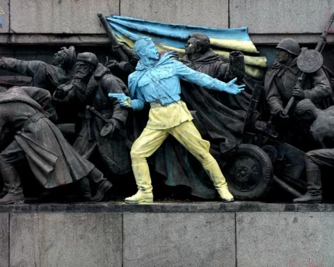A photo taken in Sofia on February 23, 2014, shows a figure painted in the colours of Ukraine on the monument of the Soviet Army in central Sofia.