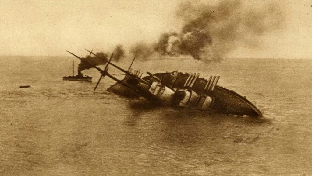 Italian postcard with photograph of the sinking of the Austro-Hungarian battleship SMS Szent István while it was proceeding to break through the Otranto Barrage, 10 June 1918. The caption reads: "Italian Navy in the World War 1915-1918. On the dawn of June 10th, 1918, Commander Rizzo attacked with two MAS a powerful enemy squadron. The Austrian battleship 'Saint Stephen', hit by torpedo, sank, capsizing on the left side".